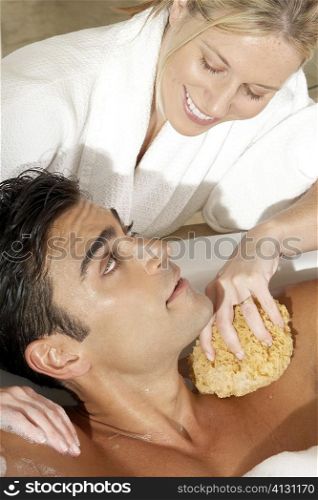 High angle view of a massage therapist talking to a young man