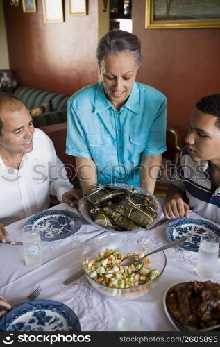 High angle view of a mature couple and their son at a dining table