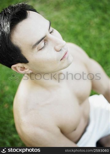 High angle view of a mature man meditating