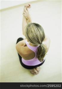 High angle view of a mid adult woman in a yoga pose
