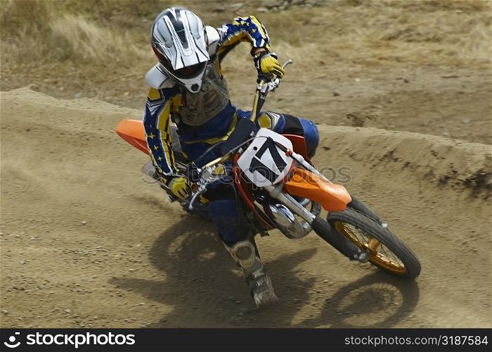 High angle view of a motocross rider riding a motorcycle