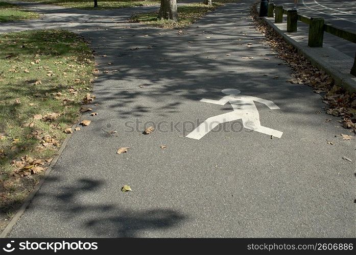High angle view of a pedestrian crossing sign painted on a walkway