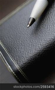 High angle view of a pen on a diary