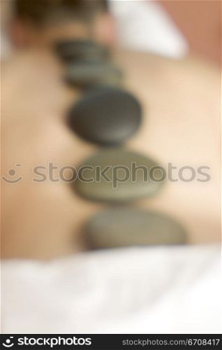 High angle view of a person getting Lastone massage therapy