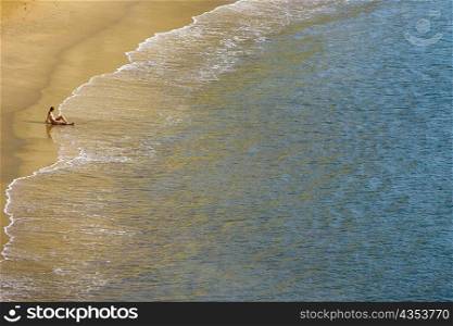 High angle view of a person sitting on the beach, Plage du Miramar, Biarritz, France