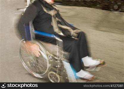 High angle view of a person wheeling a wheelchair