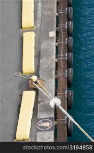 High angle view of a rope tied up with a bollard