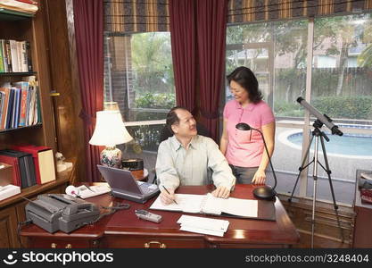 High angle view of a senior man talking to a mature woman