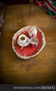 High angle view of a serving tray of espresso coffee on the dining table