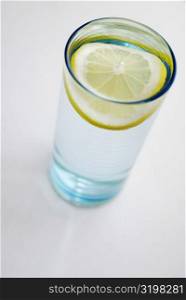 High angle view of a slice of lemon in a glass
