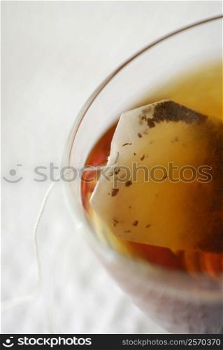 High angle view of a teabag in a cup of herbal tea