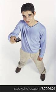 High angle view of a teenage boy holding a remote control