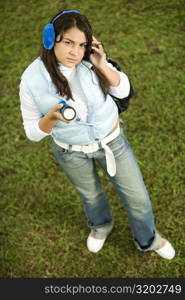 High angle view of a teenage girl holding a flashlight