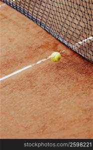 High angle view of a tennis ball near a tennis net