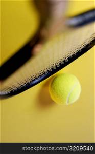 High angle view of a tennis racket and a tennis ball