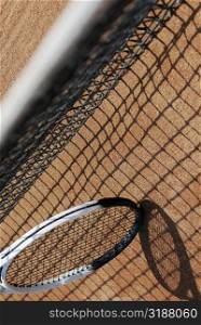 High angle view of a tennis racket and a tennis net