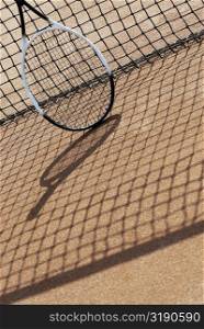 High angle view of a tennis racket with a tennis net