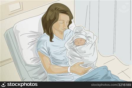 High angle view of a woman holding her baby in the hospital