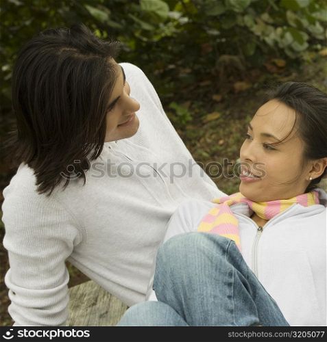 High angle view of a young couple looking at each other smiling