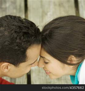 High angle view of a young couple nuzzling