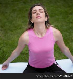 High angle view of a young woman doing yoga