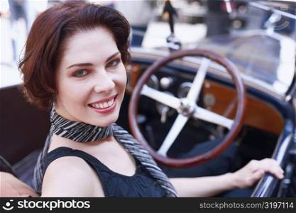 High angle view of a young woman in a car