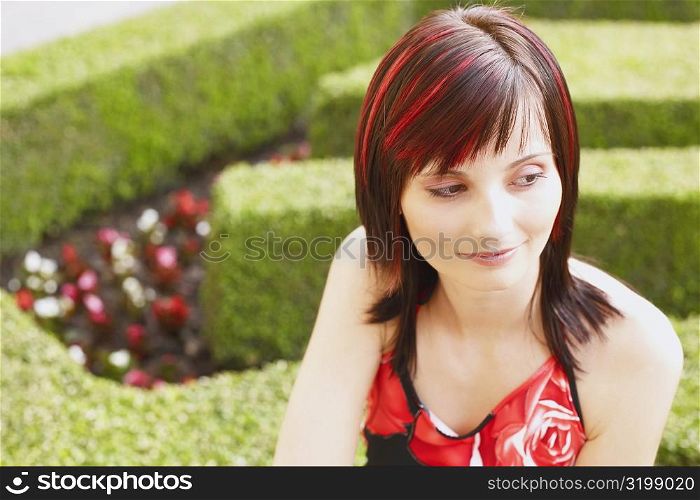 High angle view of a young woman in a garden
