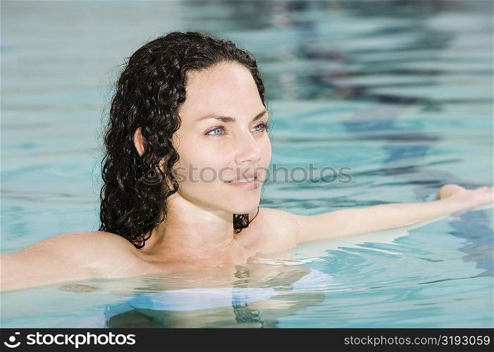 High angle view of a young woman in a swimming pool