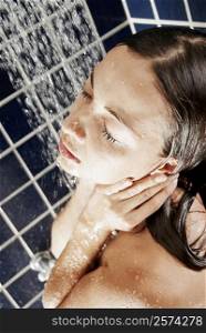 High angle view of a young woman in the shower