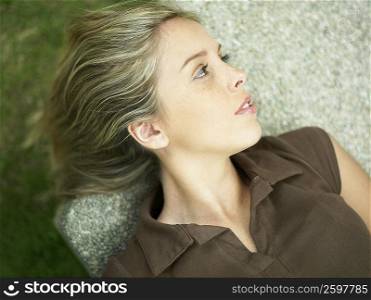 High angle view of a young woman lying down