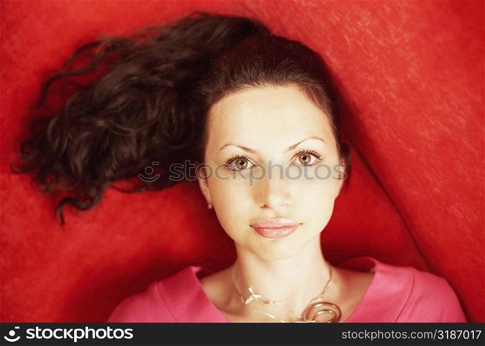 High angle view of a young woman lying down