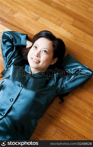 High angle view of a young woman lying on the floor