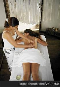 High angle view of a young woman receiving spa treatment