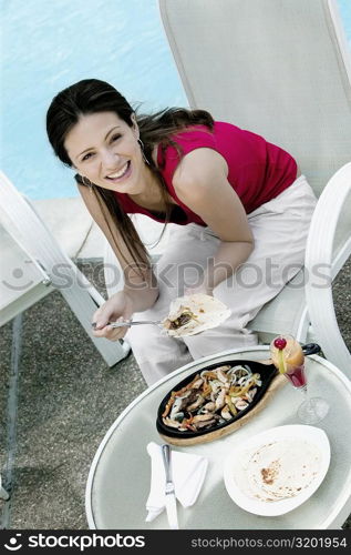 High angle view of a young woman smiling