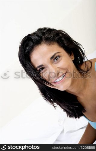 High angle view of a young woman smiling