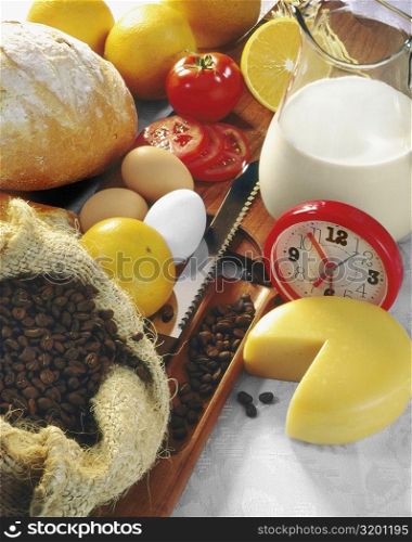 High angle view of an alarm clock with food ingredients