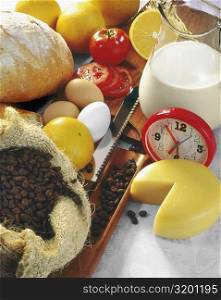 High angle view of an alarm clock with food ingredients