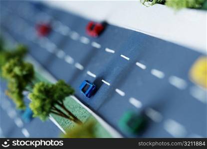 High angle view of an architectural model of a highway with traffic