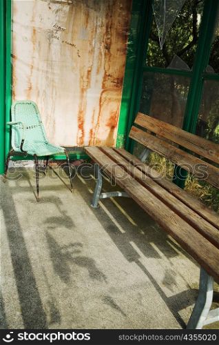 High angle view of an empty bench with a chair, La Spezia, Liguria, Italy