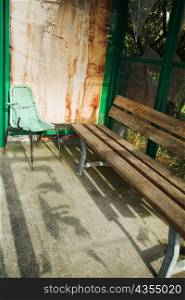 High angle view of an empty bench with a chair, La Spezia, Liguria, Italy