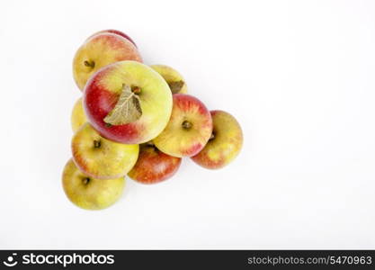 High angle view of apples forming pyramid over white background