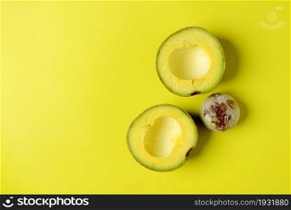 High angle view of avocados against yellow Background