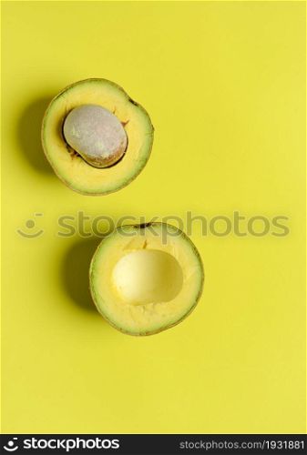 High angle view of avocados against yellow Background