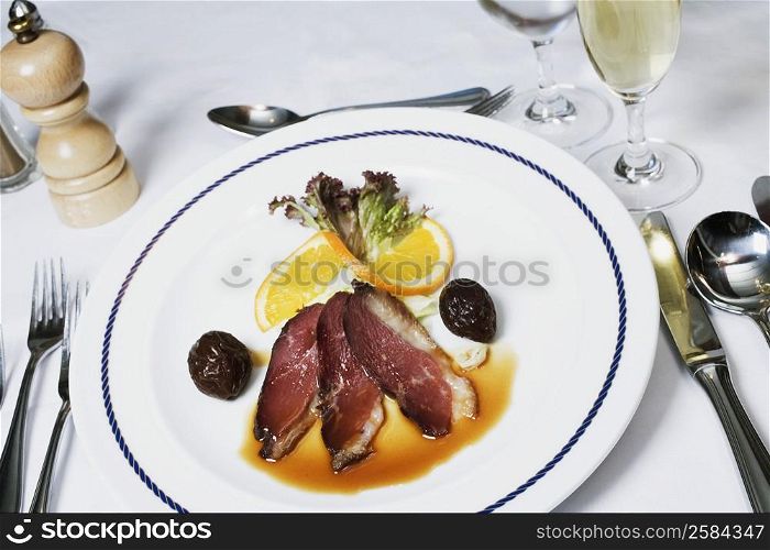 High angle view of bacon with gravy on a plate