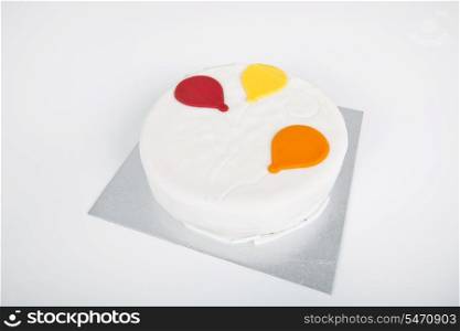 High angle view of birthday cake over white background