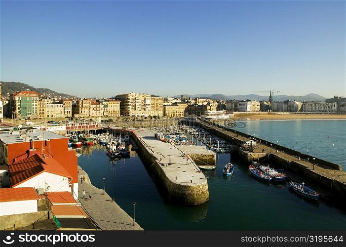 High angle view of boats docked at a harbor, Spain