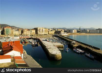 High angle view of boats docked at a harbor, Spain