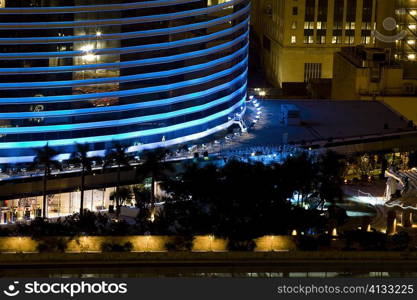 High angle view of buildings lit up at night