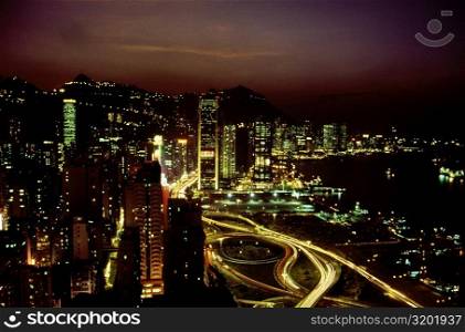 High angle view of buildings lit up at night, Causeway Bay, Hong Kong, China