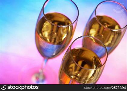 High angle view of champagne in three champagne flutes